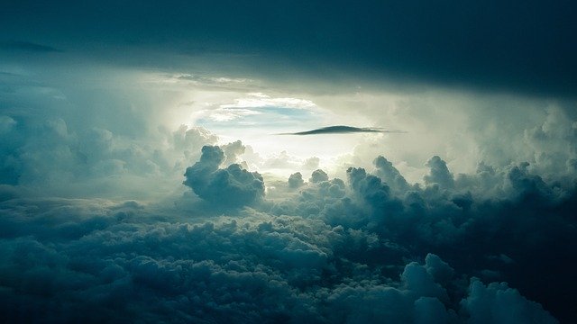 A photo of sky, clouds, and sunlight